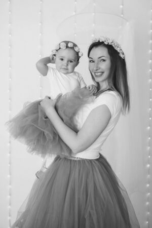the concept of a healthy lifestyle, the protection of children, shopping - baby in the arms of the mother. Woman holding a childの写真素材