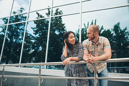A couple on a date in the city a Man admires a woman on a walk. The concept of family Day, Valentine's Dayの写真素材