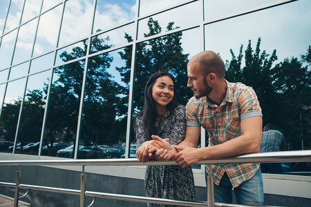 A couple on a date in the city a Man admires a woman on a walk. The concept of family Day, Valentine's Dayの写真素材