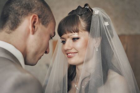 love the groom looking at the bride. A man admires a woman. The concept of family day, Valentine's day, weddingの写真素材