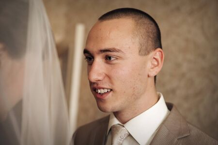 love the groom looking at the bride. A man admires a woman. The concept of family day, Valentine's day, weddingの写真素材