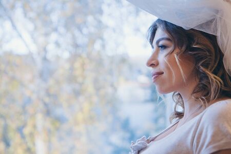 portrait of a woman in profile. Face covered with hair. Skin care concept, natural cosmeticsの写真素材