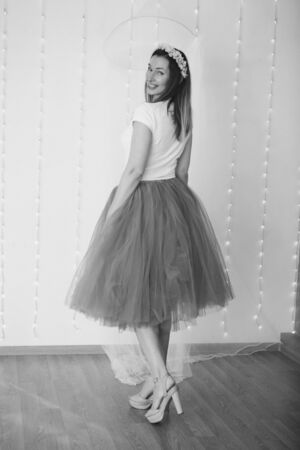 isolated photo: beautiful model with long hair shows off clothes. the concept of modeling business, is casual clothesの写真素材