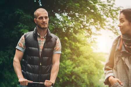 the concept of a romantic walk. A couple in love, a man looks tenderly at a woman