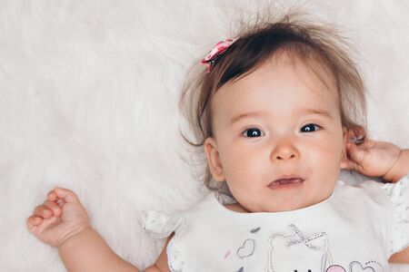 portrait of a little girl: baby's face close-up. concept of childhood, healthcare, IVFの写真素材