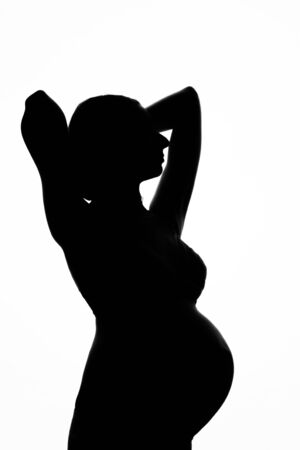 silhouette of Pregnant woman on a white background. The concept of a healthy lifestyle, IVFの写真素材