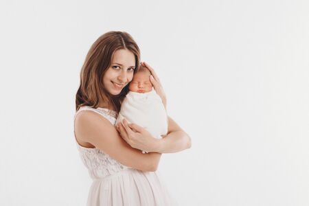 the concept of a healthy lifestyle, the protection of children, shopping - baby in the arms of the mother. Woman holding a childの写真素材