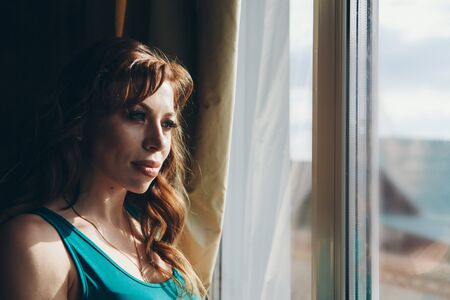 portrait of a woman in profile. The face is covered with hair. The concept of skin care, natural cosmetics, Brazilian blowout, chemistry, painting with hennaの写真素材