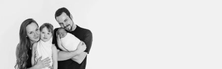 concept of healthy lifestyle, protection of children, shopping - baby in the arms of the mother and father. Woman and man holding a child. Isolated on white background. Copy space. Portrait of faamilyの写真素材