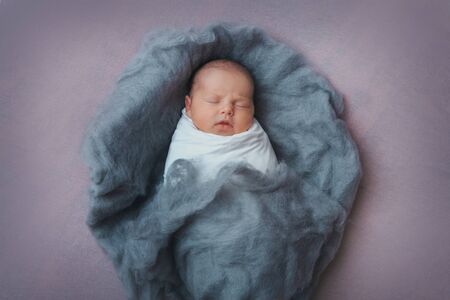 Newborn baby lying. Imitation of baby in womb. beautiful little girl sleeping on her back....
