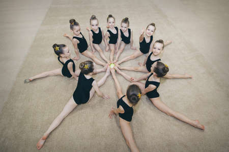 Moscow, 12.10. 2019. classes for children at citrus fitness club. a little girl is engaged in recreational gymnastics. sports exercises and stretching: athleticsのeditorial素材