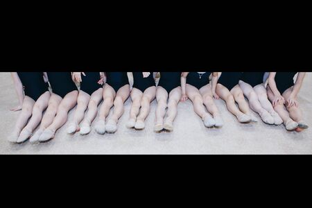 gymnast's legs close up. ballet stand on the toes. sports exercises and stretching: athletics