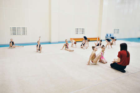 Moscow, 12.10. 2019. classes for children at citrus fitness club. a little girl is engaged in recreational gymnastics. sports exercises and stretching: athleticsのeditorial素材