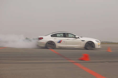 advertising BMW, Moscow, 1.11.2018: demonstration of the white car model, cars in the test track,...