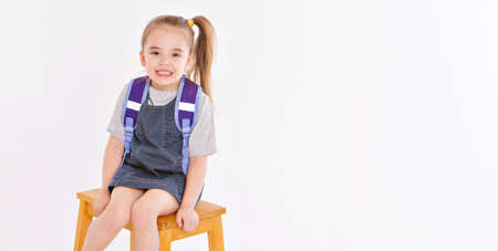 September 1. first-grader in medical school is going to school. little girl on home distance...
