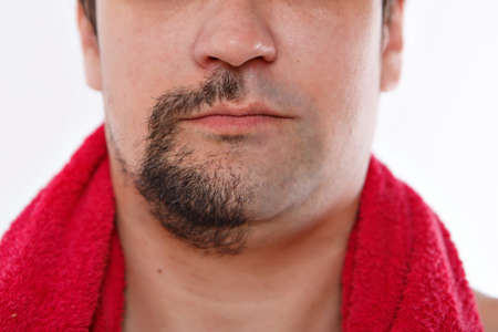 half of the beard close-up. morning treatments in the bathroom. copy spaceの写真素材