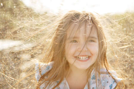 portrait of a girl with her hair down and blowing in the wind.hairstyle without antistatic. windy...