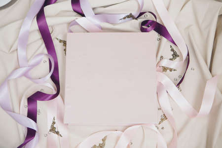 white book wrapped in leather on a white background. photo album from with a pure cover copy space....