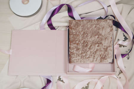 Diary close-up on a beige background. cover made of fabric. the best gift - a photo album