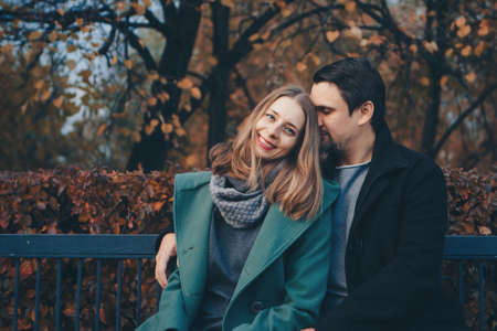 Valentine's day: a couple in love on a Park benchの写真素材