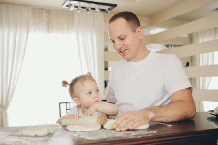 the family makes cakes. the children were covered in flour. dinner at the bakery. feast in the...