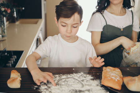 the family makes cakes. the children were covered in flour. dinner at the bakery. feast in the...