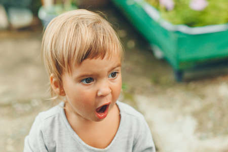 little girl with their mouth wide openの写真素材