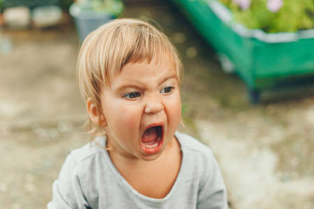 little girl with their mouth wide openの写真素材