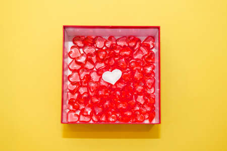 Happy Valentine's Day flatlay. Top view present gift box, hearts on yellow color of the year 2021 background. Valentine day or New Year greeting card. pantonの写真素材