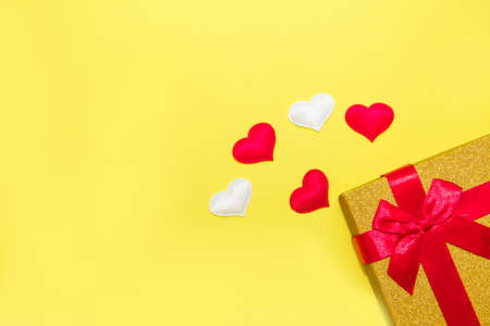 Happy Valentine's Day flatlay. Top view present gift box, hearts on yellow color of the year 2021 background. Valentine day or New Year greeting card. pantonの写真素材