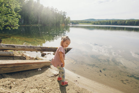 girl sunbathing in the water by the riverの写真素材