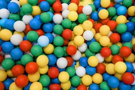 colored plastic balls in a children's playroom. background. texture.の写真素材
