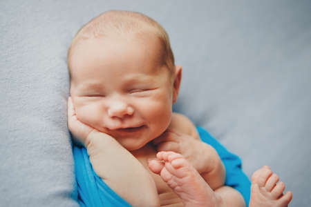 Portrait of newborn baby on a white background.の写真素材