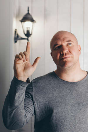 the man's hands show signs. Sign Language: Thumbs upの写真素材