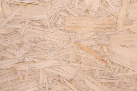 Chipboard plywood. pressed wood close-up. Background: wood shavings. copy spaceの写真素材