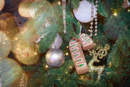holidays, new year, decor and celebration concept - close up of christmas tree decorated with balls...