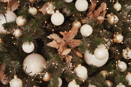holidays, new year, decor and celebration concept - close up of christmas tree decorated with balls...