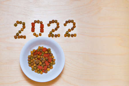 food for cats and dogs and the new year. Dry food label. Pet treats in 2022の写真素材
