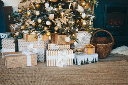 holidays, new year, decor and celebration concept - close up of christmas tree decorated with balls and toysの写真素材