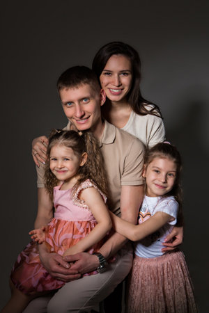 family photo: love. parents spend time with their children. mom and dad hug the baby. the concept of childhood, fatherhood, motherhood, IVFの写真素材