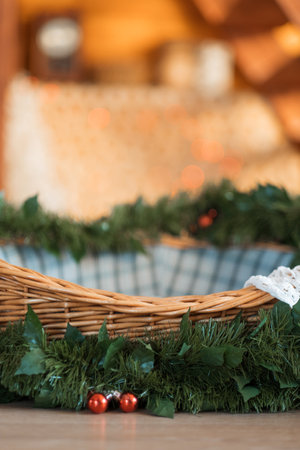 Christmas basket with Christmas tree and lanterns. Nativity scene, background for text. Festive lights. High quality photoの写真素材