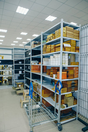 product warehouse in the store. Shelves in the back room. Retail Warehouse full of Shelves with Goods in Cardboard Boxes and Packages. Logistics, Sorting and Distribution Facility for Product Delivery. High quality photoの写真素材