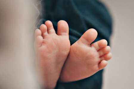the legs of a newborn. the heels, the fingers of a baby, a child. Childbirth, family, love.