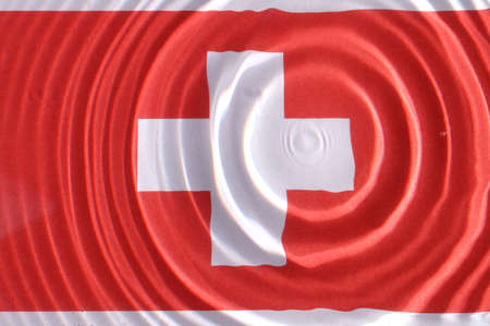Swiss flag under water with nice circles and ripplesの写真素材