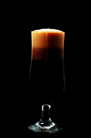 glass foamy dark beer,isolated on white background