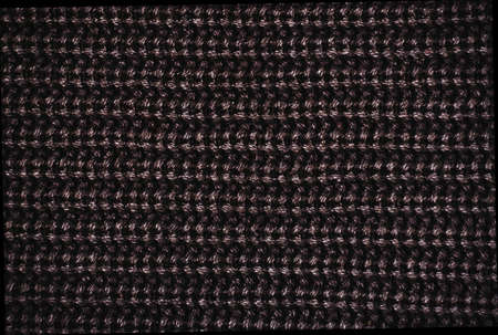 closeup of knitted dark  fabric texture の写真素材