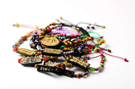 Heap of glass bead accessories on white  Homemade jewelry の写真素材