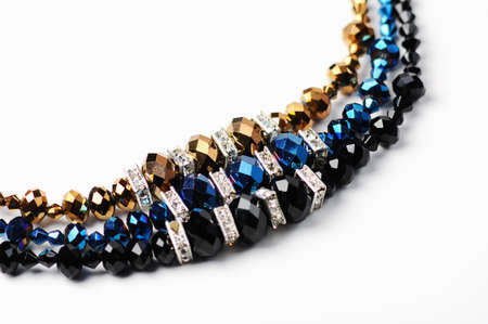 Beautiful  shinyng  necklaces  closeup on white background  and space for textの写真素材