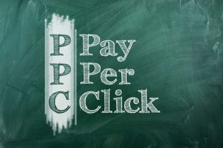 PPC -  Pay Per Click  acronym on green chalkboardの写真素材