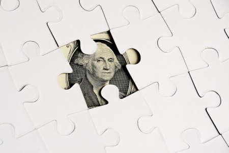Dollar hidden under  Puzzle, business concept of Solution